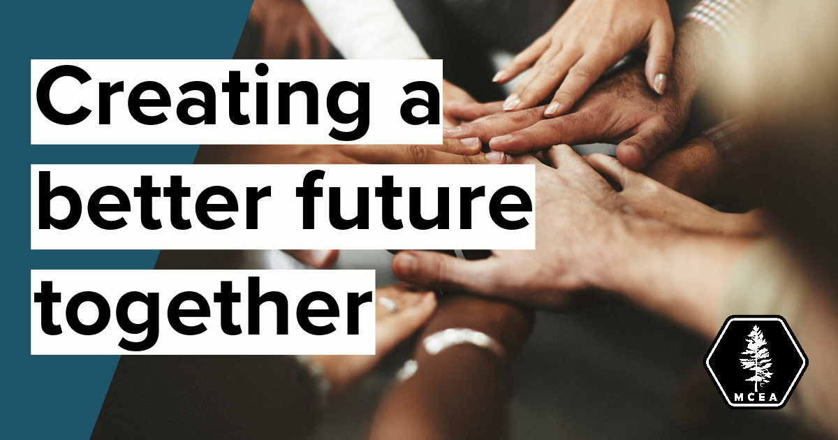 hands from people of different ethnic backgrounds in a circle with the words "creating a better future together"