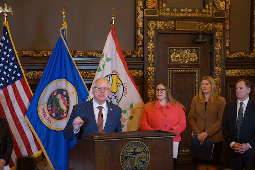 governor walz, a white man, talking in front of people