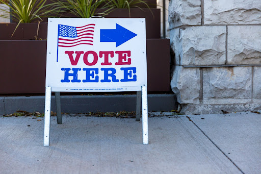 "vote here" sign