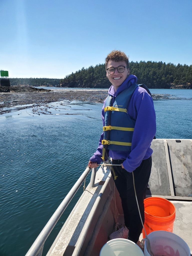 photo of Isaac, a young white man, on a boat