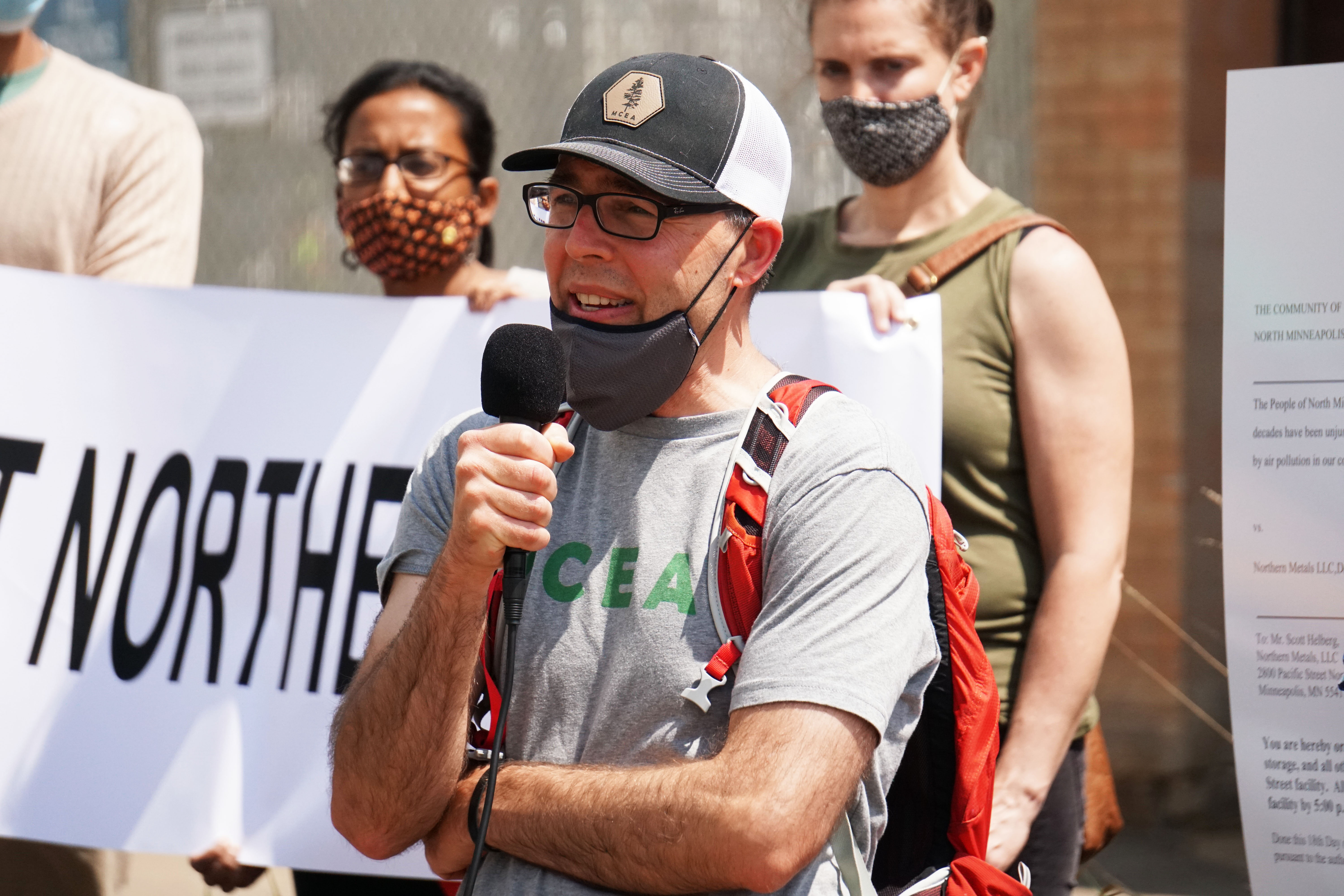 healthy communities program director evan mulholland speaking at a rally