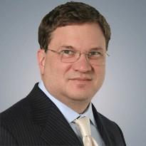 Rick Duncan. White man wearing suit.