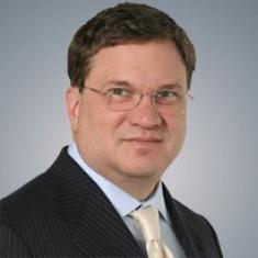 Rick Duncan. White man wearing suit.