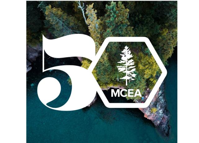 50th logo over a photo of a lake and trees
