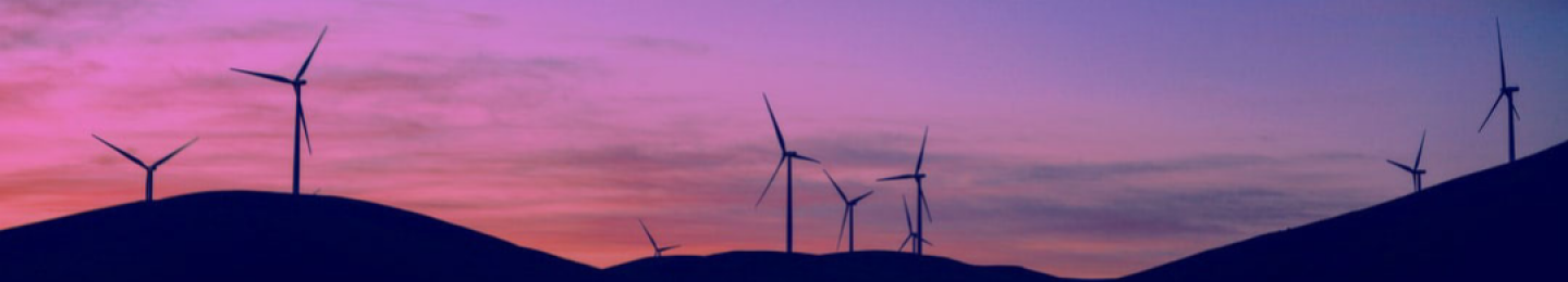 wind turbine on a hill with a purple sky