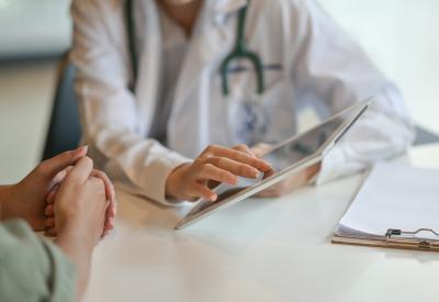 image of doctor showing a chart to a patient