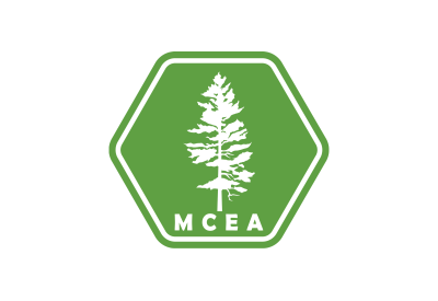 m c e a logo, a pine tree silhouetted on a green hexagon