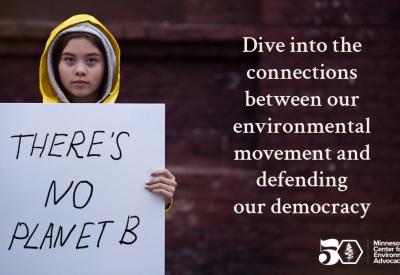a girl in a yellow rain jacket holds a sign that says "there's no planet b"