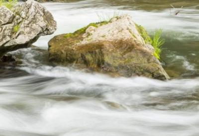 flowing stream and the words a big win for clean water in Minnesota