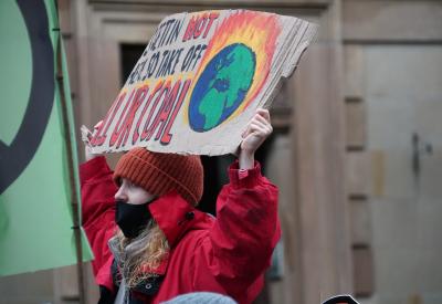 protester at glasgow march during COP26