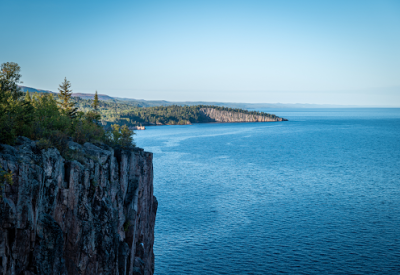blue water of lake superior and a cliff