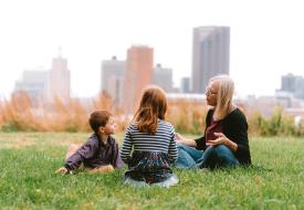 barb sits with her grandchildren