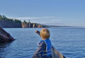 pointing at lake superior shoreline