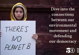 a girl in a yellow rain jacket holds a sign that says "there's no planet b"