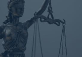 blue overlay on top of "justice" a blindfolded woman holding scales