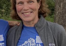 libby bent smiling in a shirt with lake superior on it