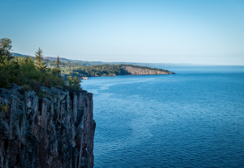 blue water of lake superior and a cliff