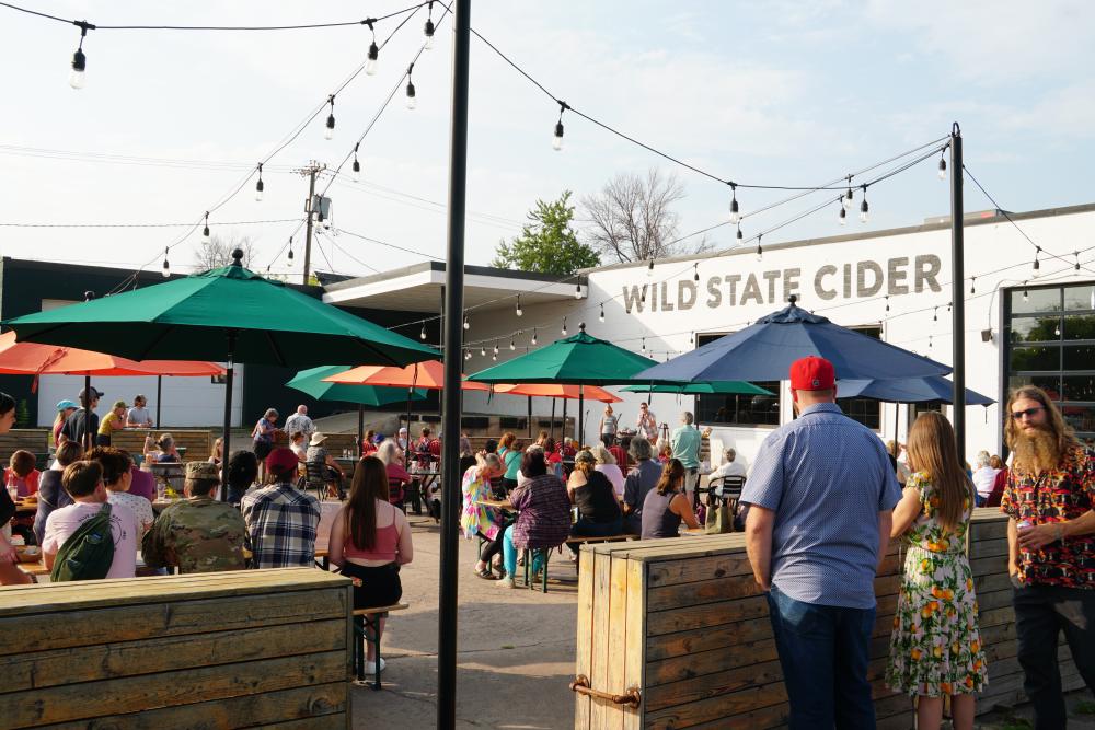 photo of the crowd at the M C E A event at Wild State Cider