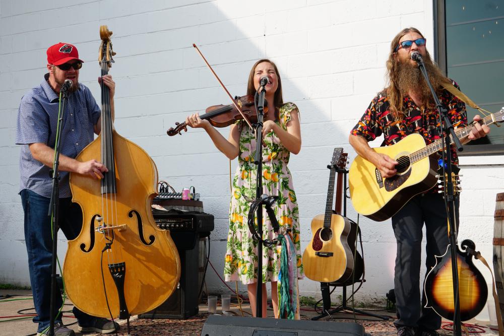 Photo of three piece band called MorningBird performing at Duluth event.